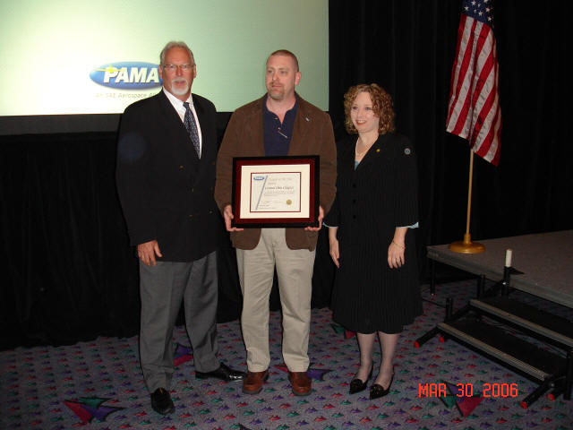 PAMA Director Dave Orcutt presents Award to Jeff Gruber and Donna Bricker.