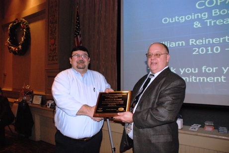 Bill Reinert receives Award Plaque from Gene Sprang.