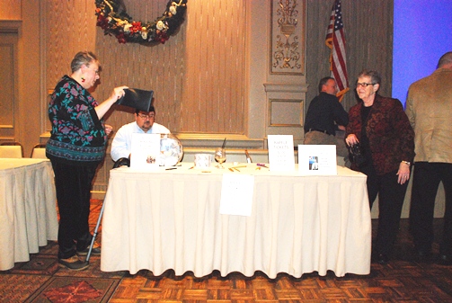 Volunteers work at the raffle tables.