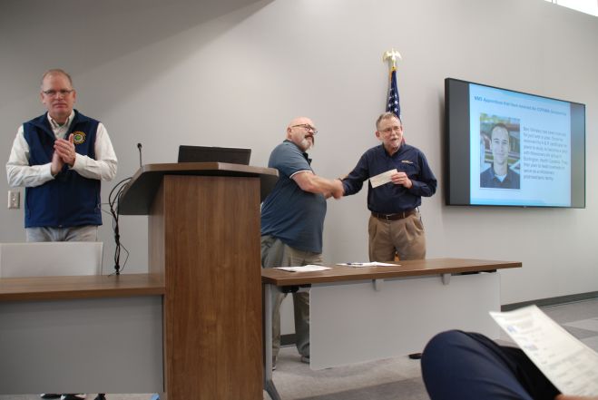 Steve Brown presents check to MMS Aviation.