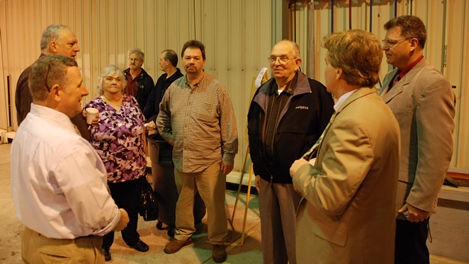 Cliff and his family discuss the award with the FAA representatives.